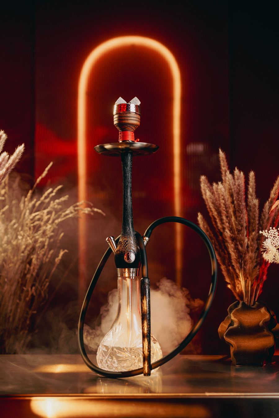 Crystal hookah under the red neon arch at IKIGAI