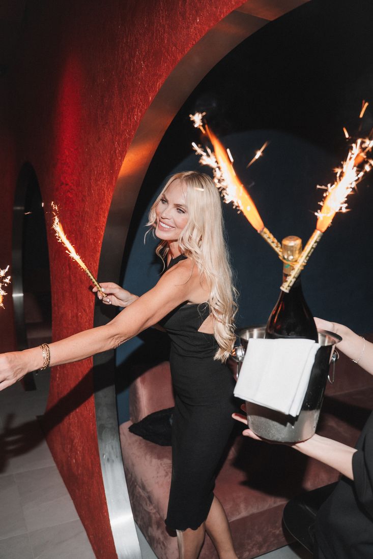 Guest by the red arch with sparklers